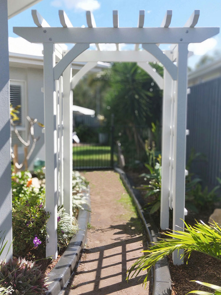 The Arbour has been painted in Surfmist to match the house and it look fantastic in the lush gardens.