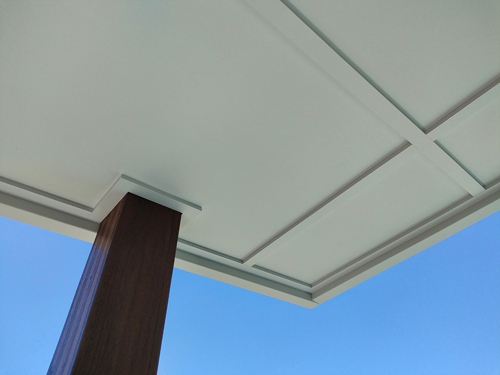 The Lamainted Hardwood Spotted Gum Post are attached to the roof framing and ceiling lining has been trimmed for a clean finish.