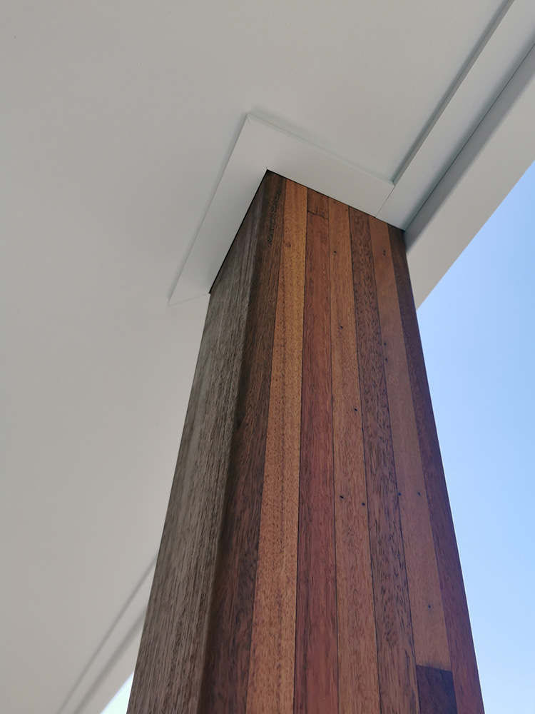 The Lamainted Hardwood Spotted Gum Post are attached to the roof framing and ceiling lining has been trimmed for a clean finish.
