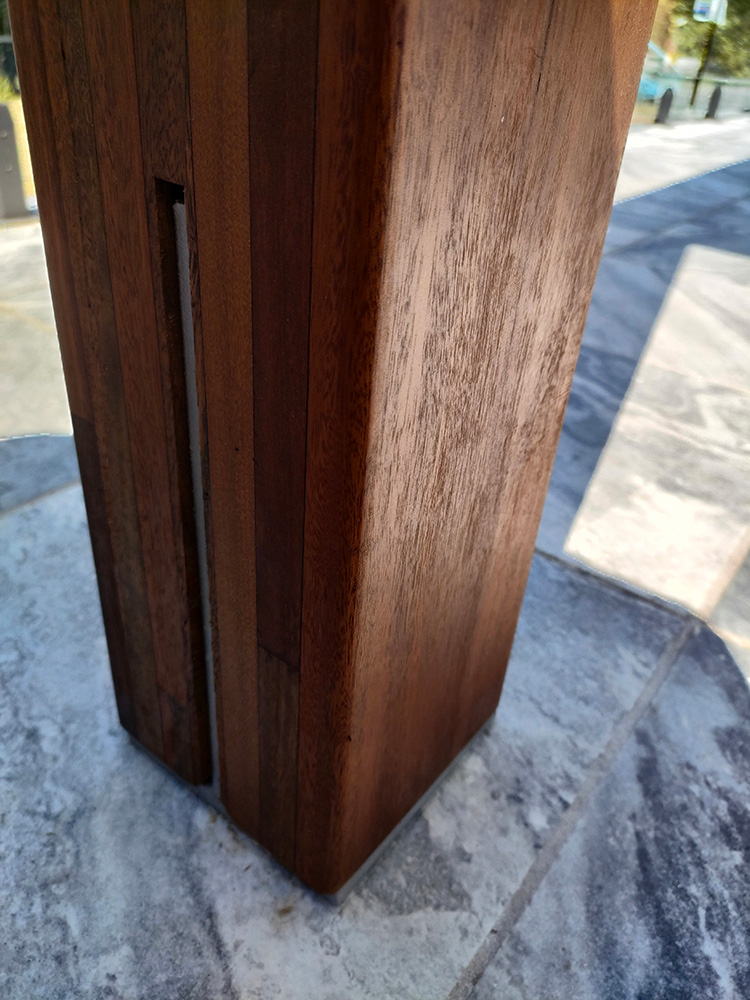 Laminated Spotted Gum Posts have been selected for this Pergola. We have carefully cut the post bases for a nice finish showing the knife plate slots and timber buttons on only one side of the posts.