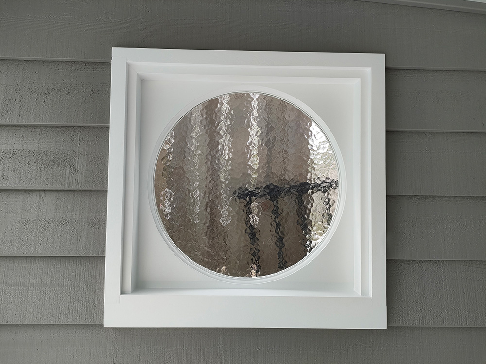 The round windows were ordered to match the existing windows in the residence. The windows are painted in White on White Dulux paint color and the color contrast is great against the Quaker Grey color.
