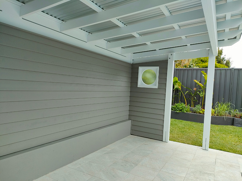 The Pool Cabana has a shorter side wall with two posts and a glass pool gate will be set between the posts.