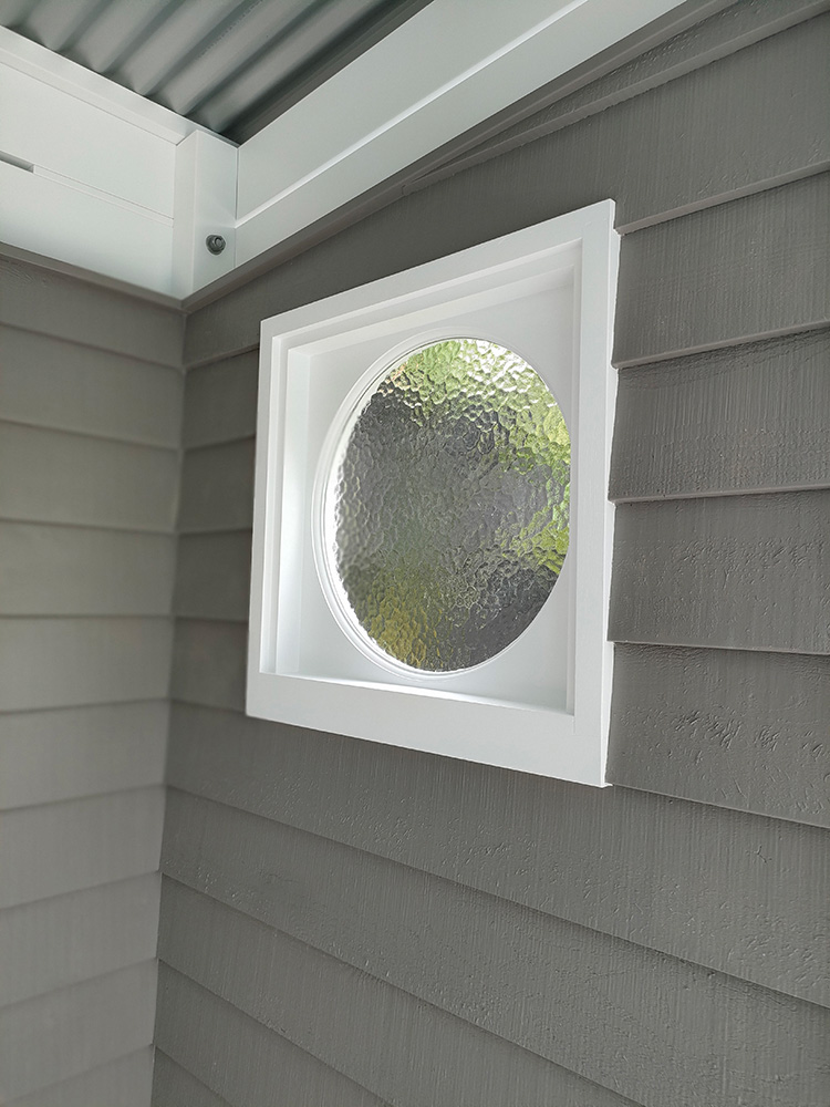 The round windows were ordered to match the existing windows in the residence. The windows are painted in White on White Dulux paint color and the color contrast is great against the Quaker Grey color.