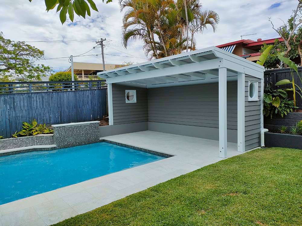 The walls cladding and windows are matched to the residence to continue the finishing details from the house into the Pool Cabana area.