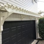 Painted Eyebrow Garage Pergola to match 1915 style Queenslander features and accents. Designed to create a feature for the side of the house above the garage.