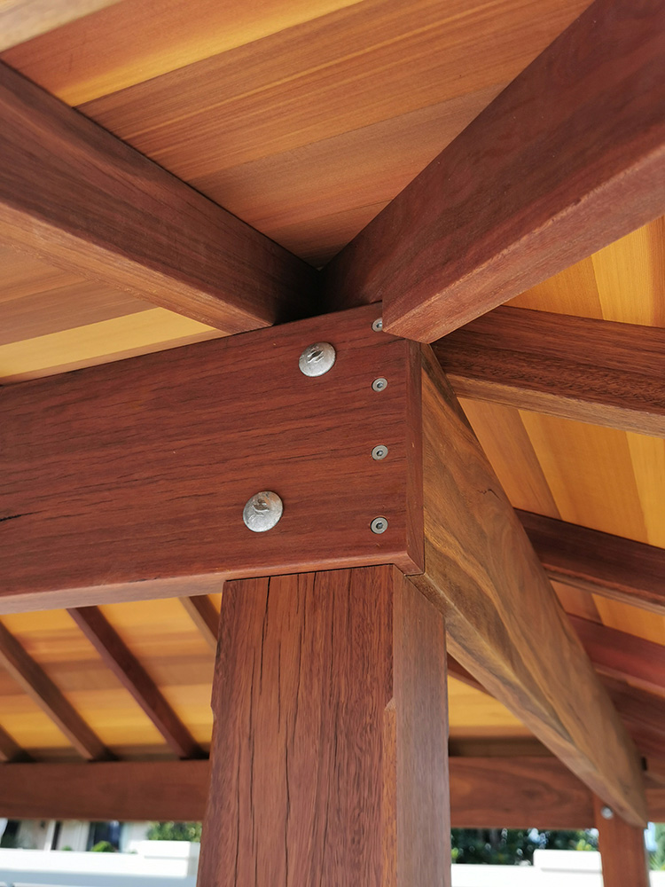 The beams are cut into the posts and hips knotched in for a solid roof frame.