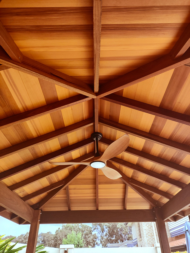 The cedar ceiling line looks absolutley stunning in this Gazebo and Wow the ceiling fan sure matches and looks fantastic.