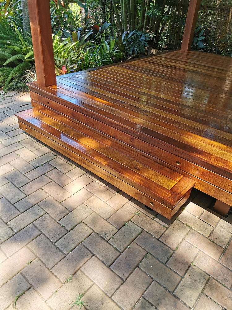 A stair has been added to the front corner of the deck and holes pre-drilled for lighting to be set by the electrician that is following our installation.