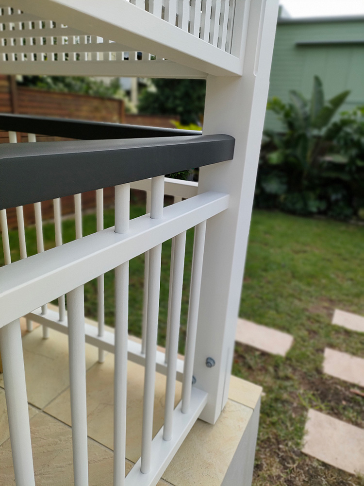 The handrail panels have been built to match the residence and fit precisely between the posts.