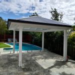 This painted Pine White Gazebo looks just beautiful with the Monument Colorbons roof and gutter.