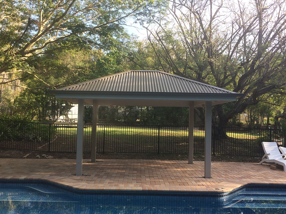 Gazebo set into existing pool surround. Painted Gazebo with hardwood posts concreted in ground.