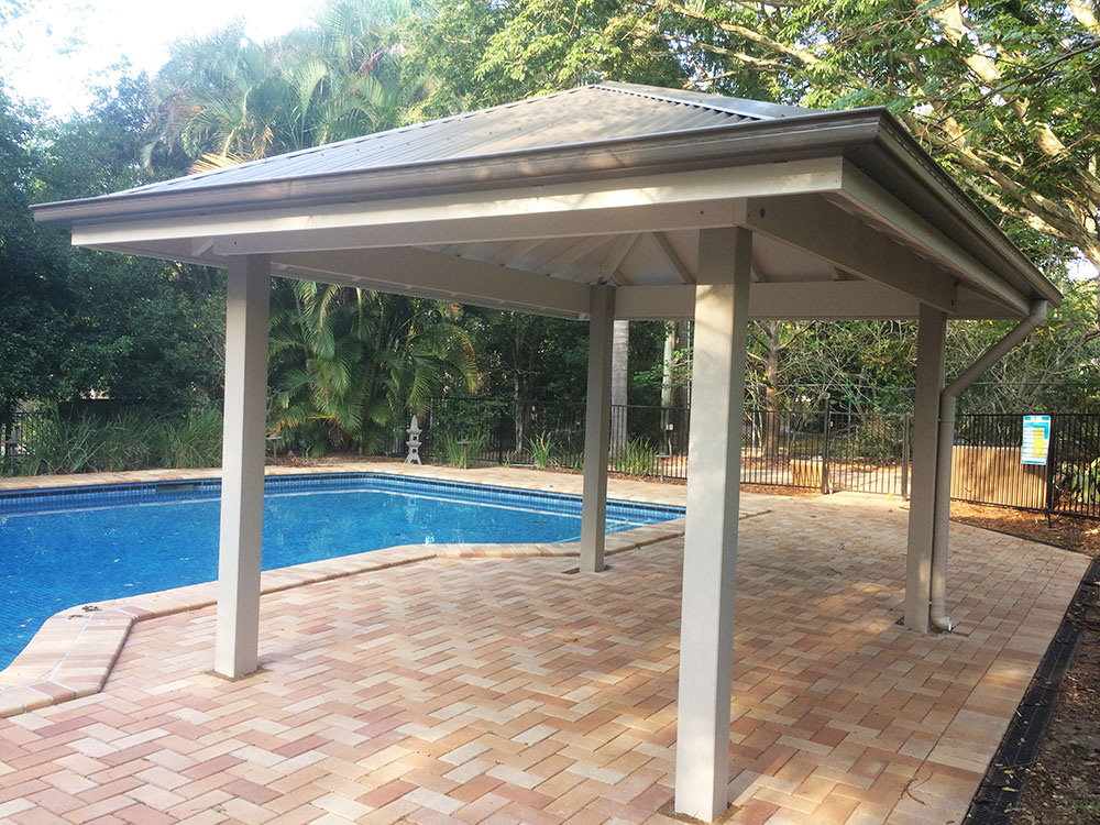 Gazebo set into existing pool surround. Painted Gazebo with hardwood posts concreted in ground.