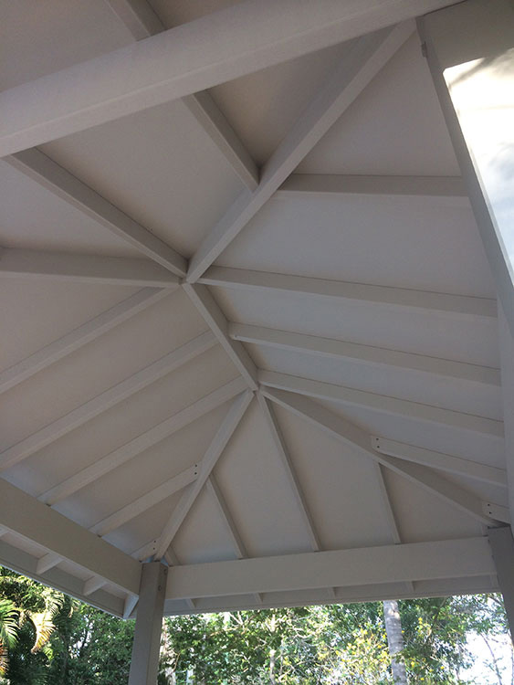 Gazebo set into existing pool surround. Painted Gazebo with hardwood posts concreted in ground.