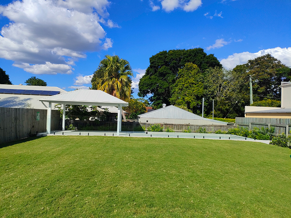 This beautiful large Gazebo in Hampton's white style with VJ ceiling looks fantastic overlooking the pool and large backyard at a house in Sherwood, QLD.