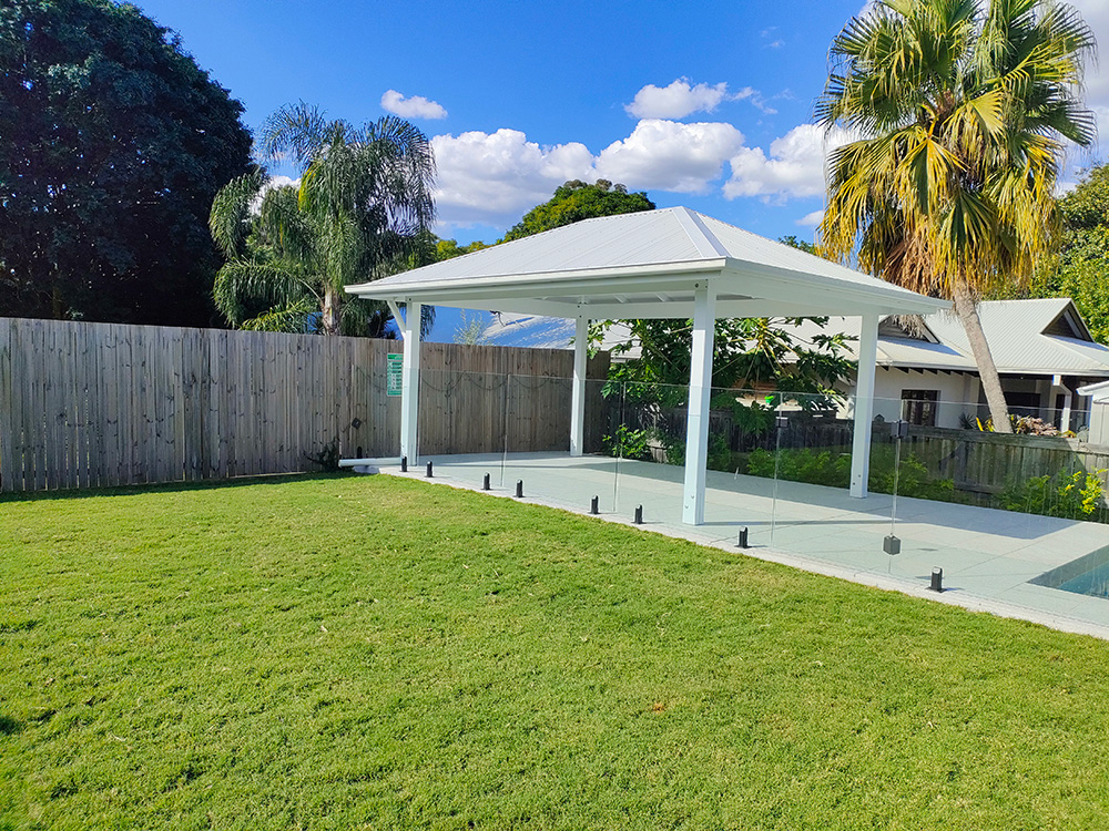 This lovely white Gazebo looks beautiful beside the pool and large lawn at this residence in Sherwood, QLD.