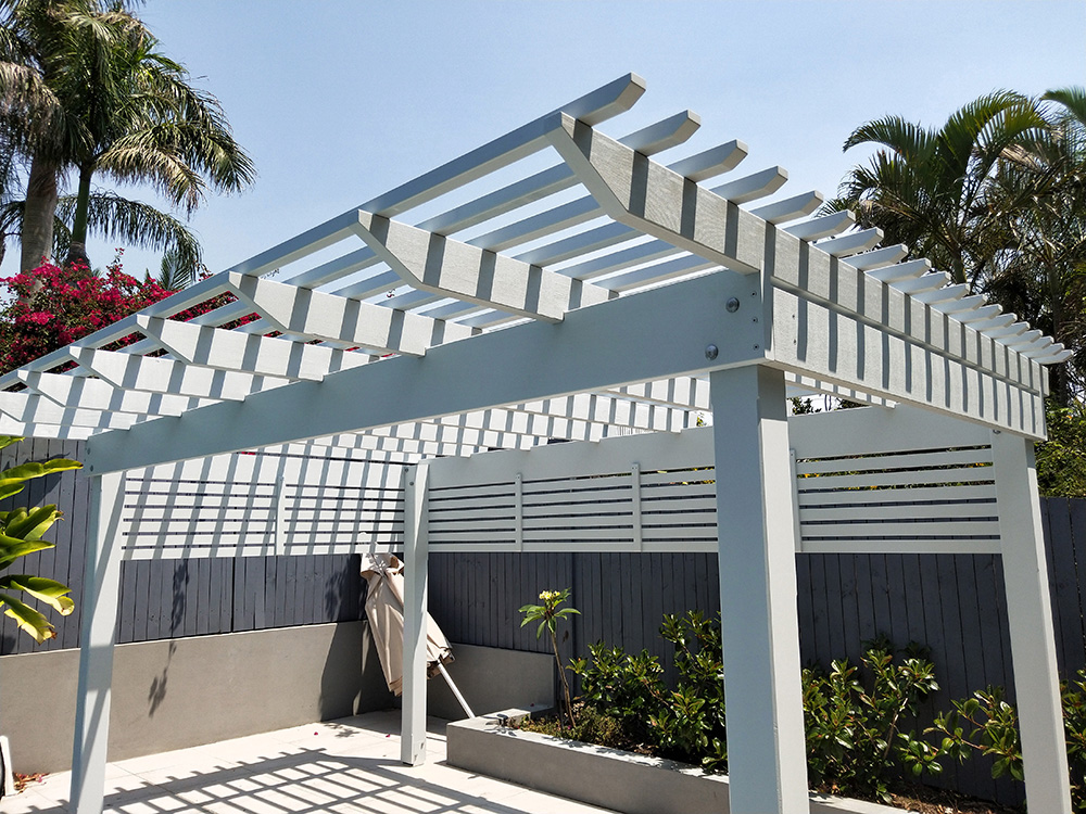 This Pergola has a front overhang to create extended shade over the pool steps.