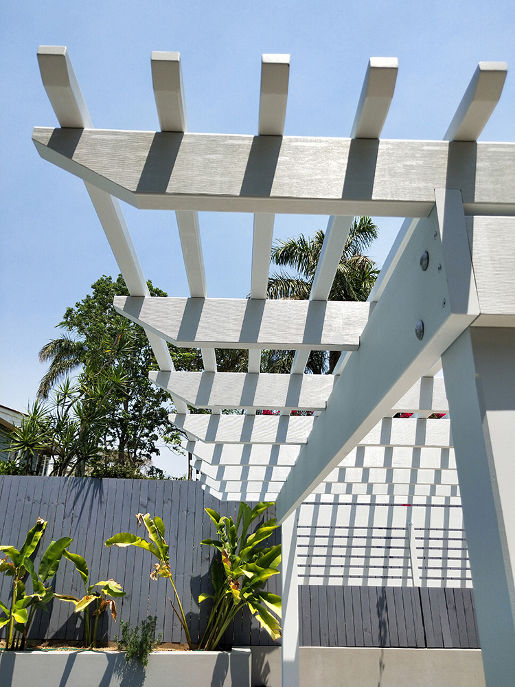 This Pergola has a front overhang to create extended shade over the pool steps.