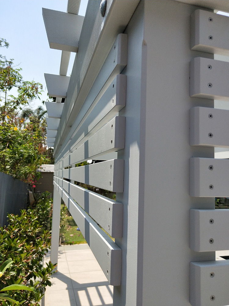 This Pergola has privacy screening on two sides with internal stays.