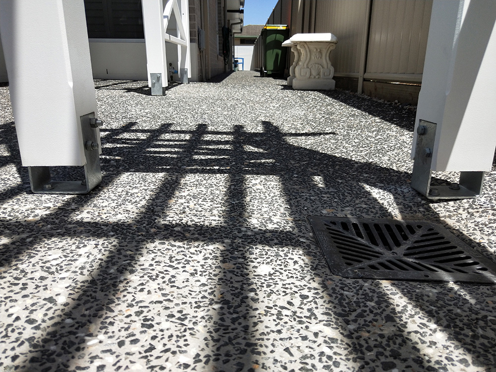 This Pergola has been set on a slightly sloped aggregate driveway and the posts set at specific precise heights.