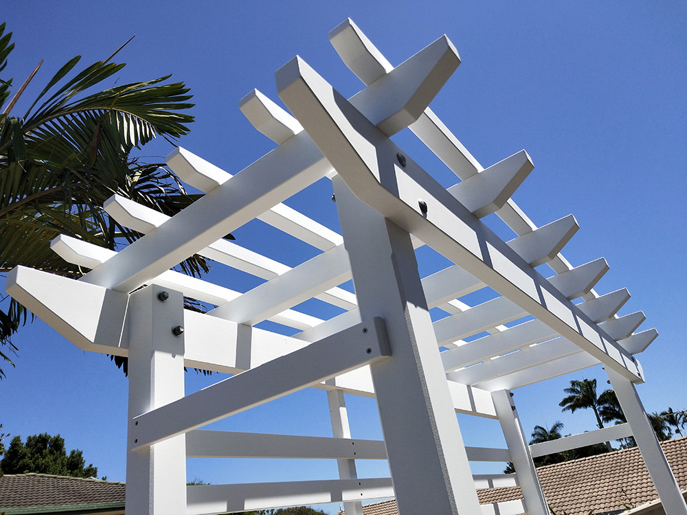 The splayed Pergola profile has been selected for this painted Pine Pergola.