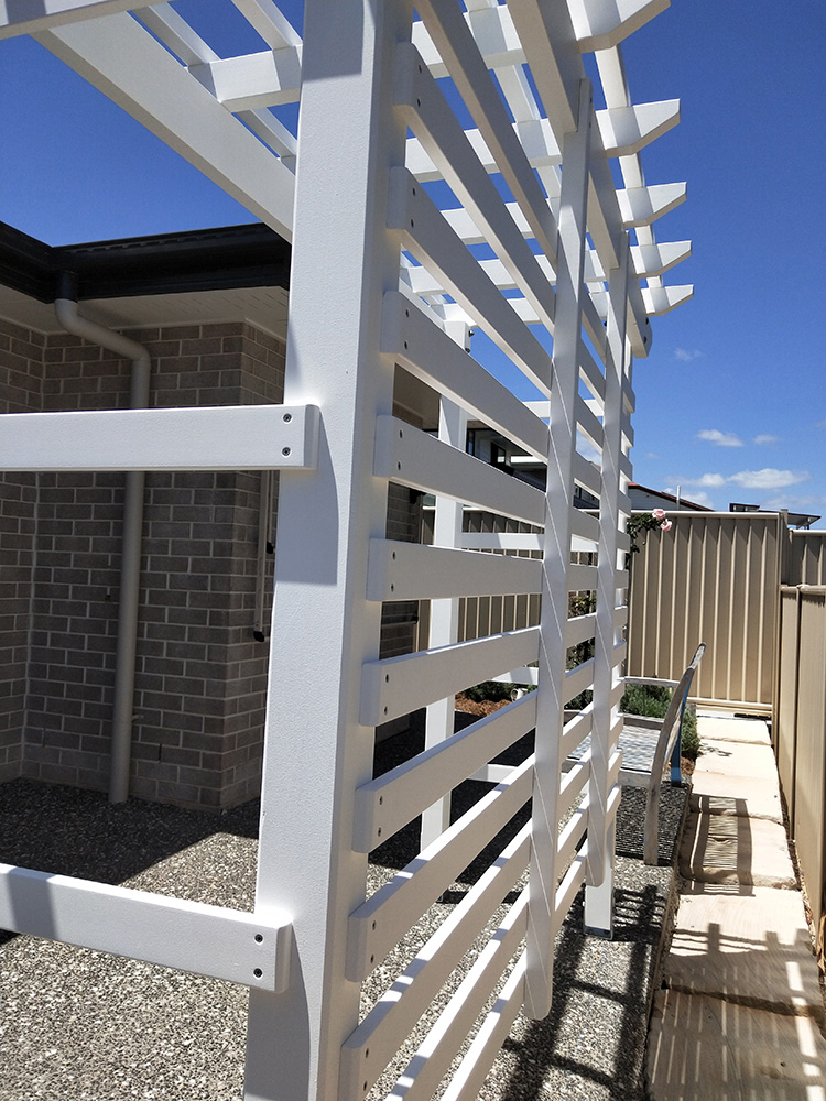 This Pergola has horizontal screening added to the back and sides which will provide both privacy screening and added green space with a new sitting area when the bench seat is added.