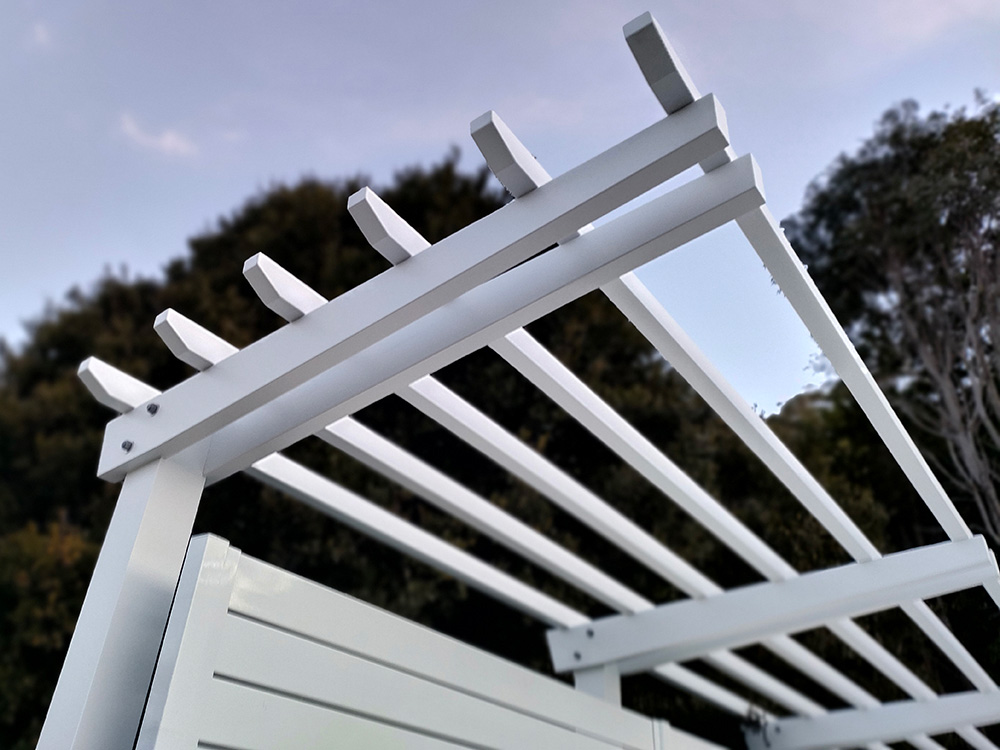This white Pine Pergola has been painted in Lexicon Quarter which matches a Pearl White Colorbond fence.