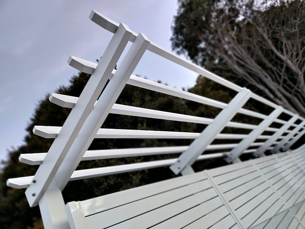 This white Pine Pergola has been painted in Lexicon Quarter which matches a Pearl White Colorbond fence.