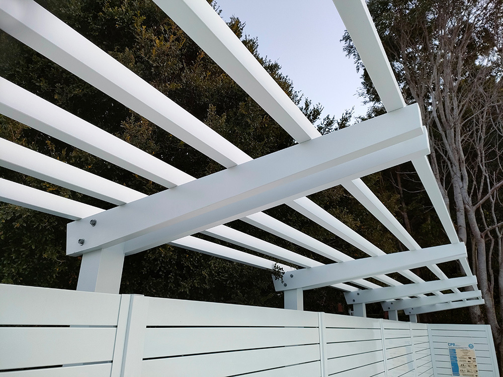 The Pergola sits just over a custom make pool blanket box which stretches across this side of the pool.