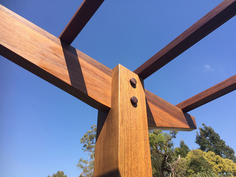 Rafters are cut into the posts to create a mortise connection and timber pinned to show a flawless finish.