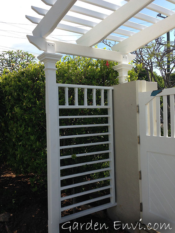 Side panels designed so that vines can grow up the sides of the entry pergola.