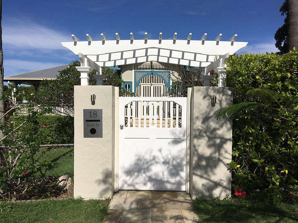 Entry Pergola set upon existing rendered gate.