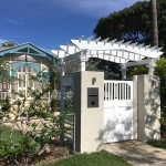 This Pine Entance Arbour has hand-crafted elements to match this heritage house.