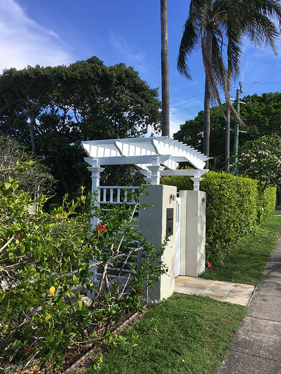 Entry Pergola set upon existing rendered gate.