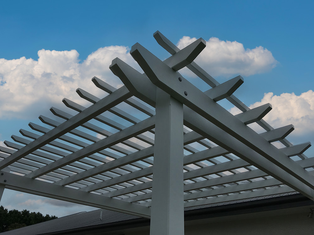 Painted Pine Pergola with double beams and tightly spaced battens.