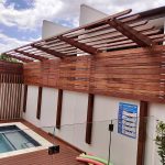 The screening on the Cantilever Pergola provides excellent privacy for the pool area while adding some shade over the pool steps.