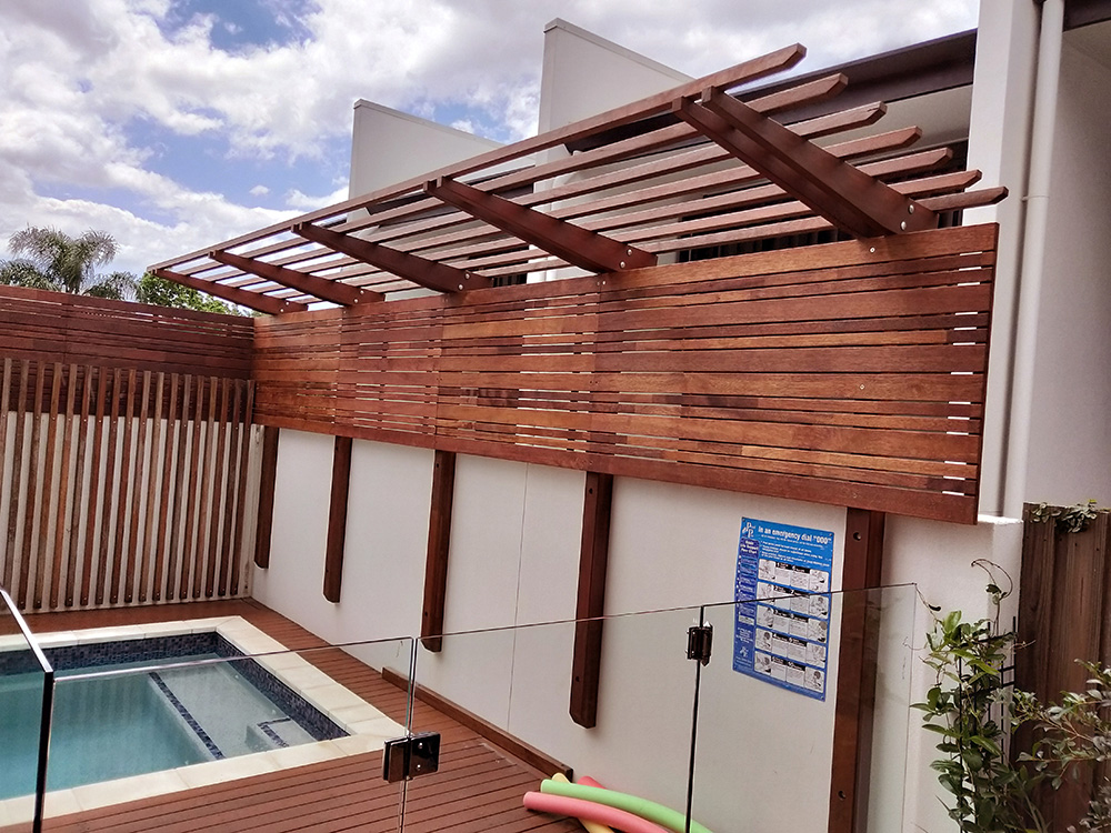 The screening on the Cantilever Pergola provides excellent privacy for the pool area while adding some shade over the pool steps.