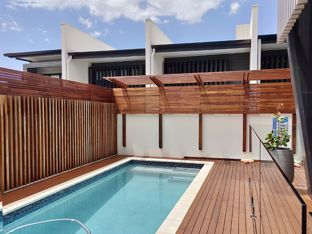 The Spotted Gum Cantilever Pergola has had some Merbau screening added to provide privacy from the townhouse complex next door.