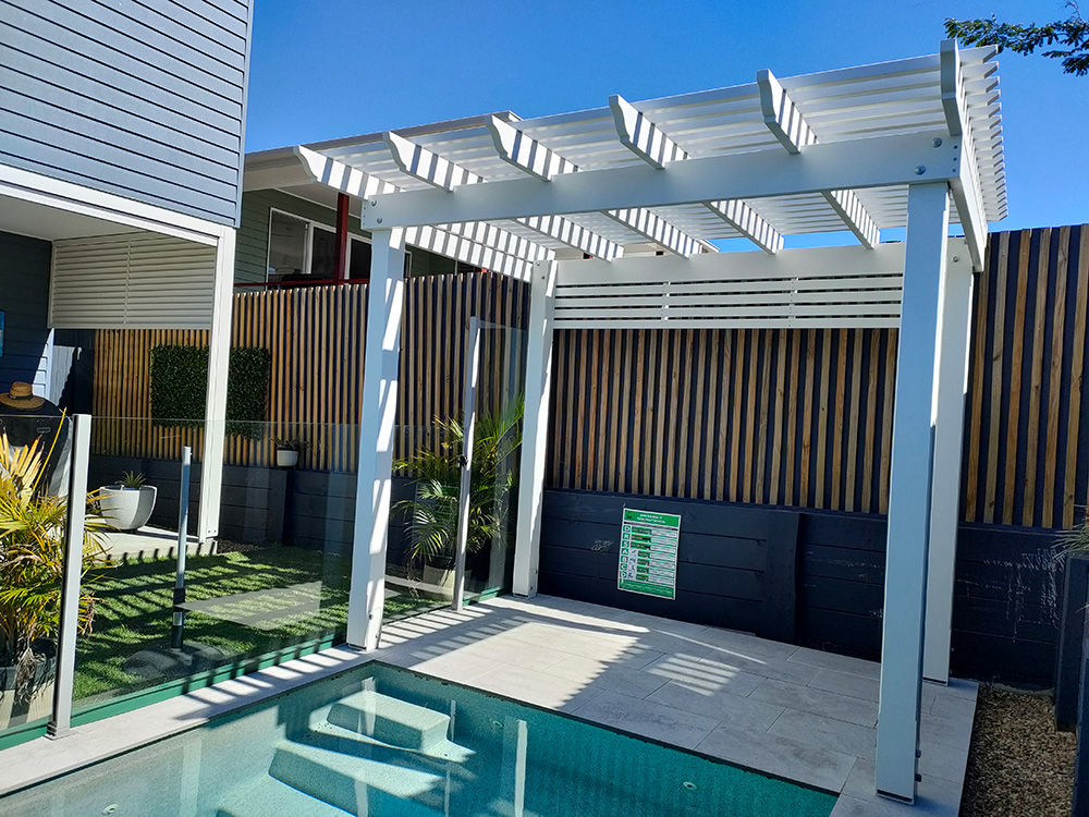 This fully painted Pine Pergola looks fantastic with the OGEE profile that was selected.