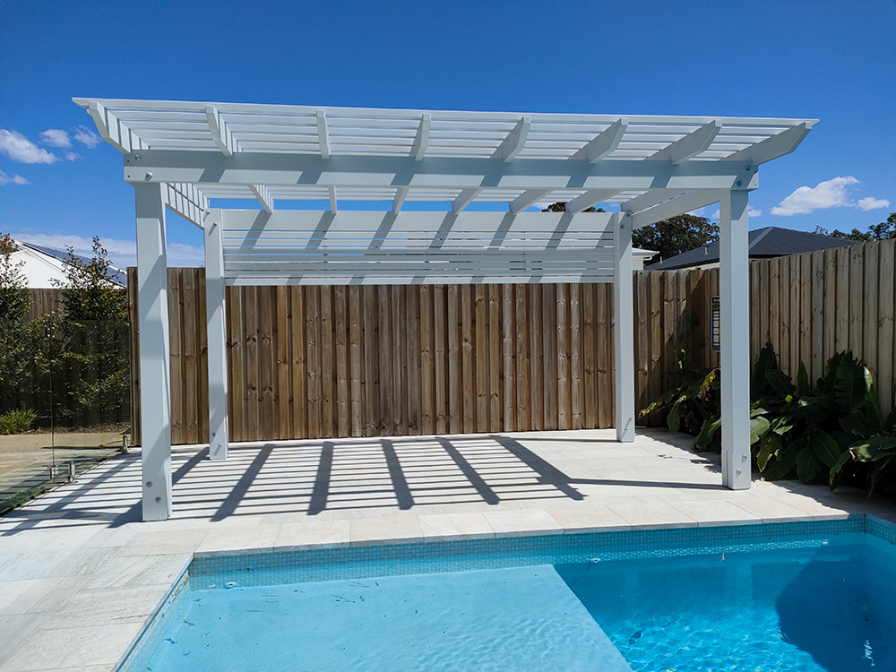 This Pine Pergola in modern style with square sides creates a lovely new area beside the pool.