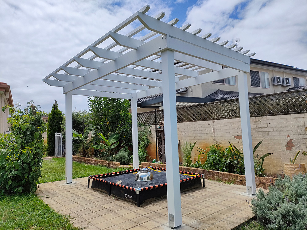 This painted Pine Pergola has a small overhang off the front and it's modern style looks great at this residence on the Gold Coast.