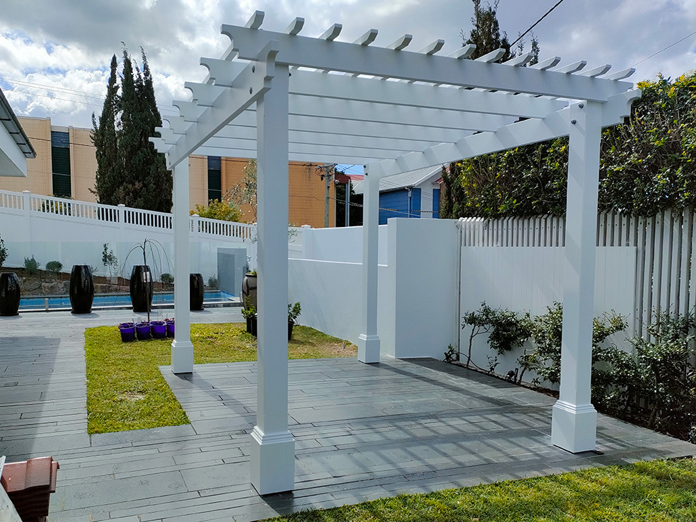 This new painted Pine Pergola creates a new sitting area outside the french door bottom entrance and overlooking the pool area.