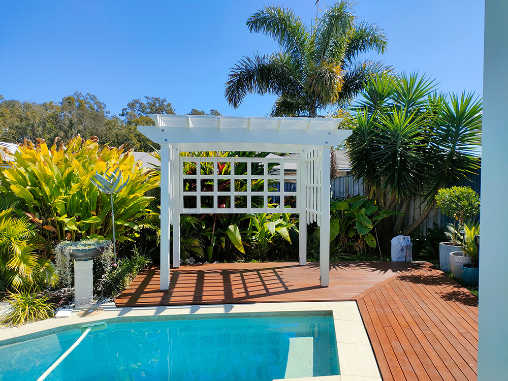 This Small Pergola with Screening creates a perfect sitting area for 2.