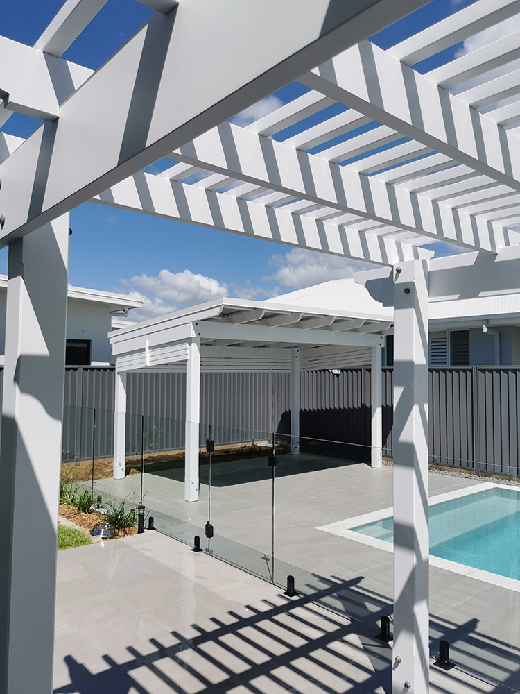 These two structures compliment each other creating a beauful backyard for this residence in Pelican Waters on the Sunshine Coast.
