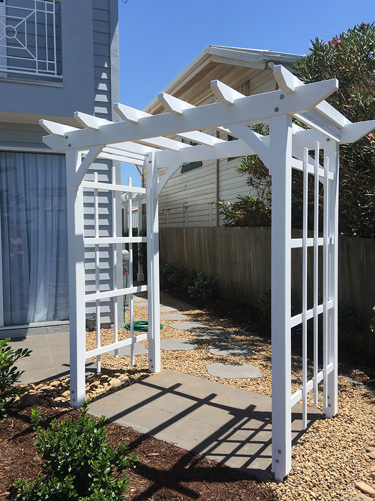 White Painted Pine Arbour fit to the paved area.