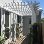 Pine Pergola set into the side entrance, complimenting the new green wall and set into newly paved area.
