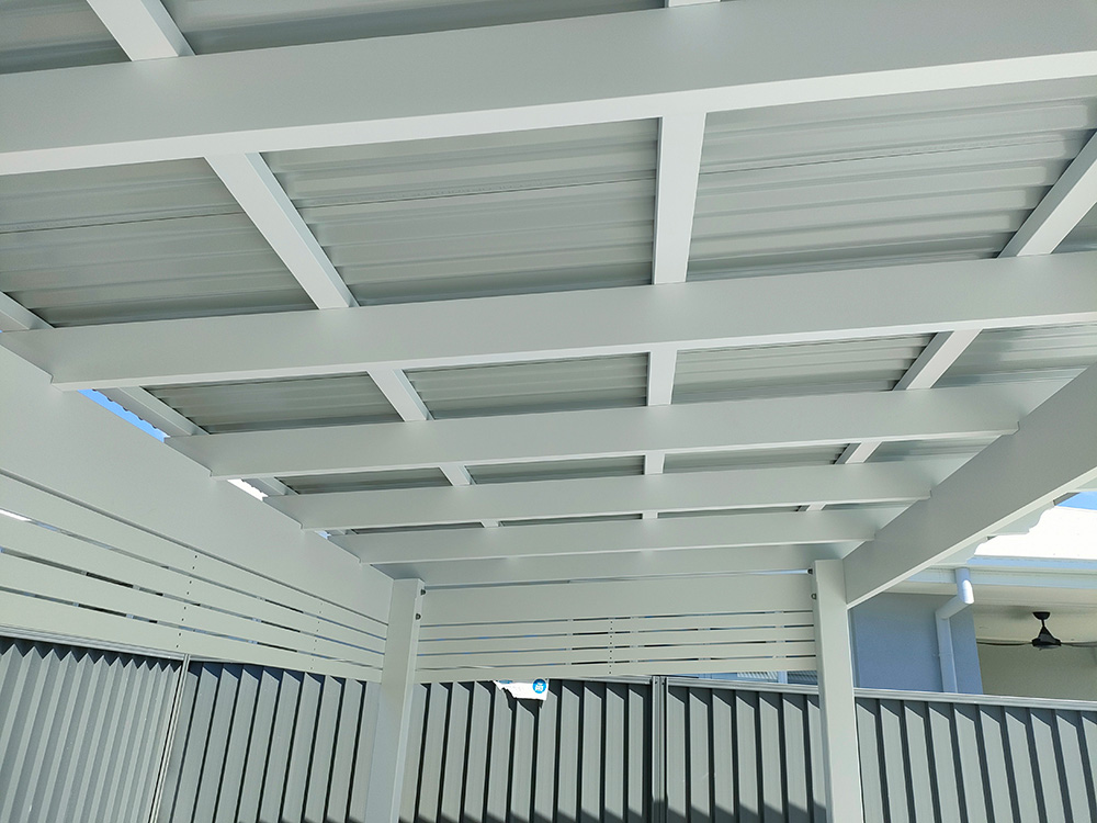 The colorbond shows through the exposed rafters and battens and it looks nice and clean.