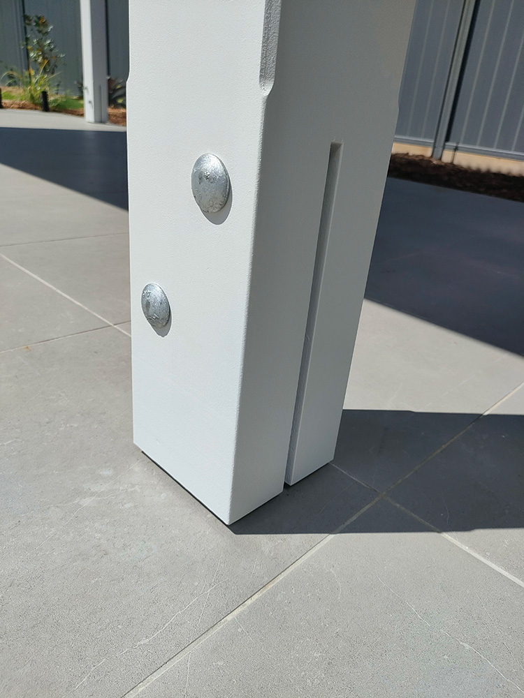 The Galvanized T-Blade post brackets are mounted to the hand cut post base and provide a beautiful and clean finish.
