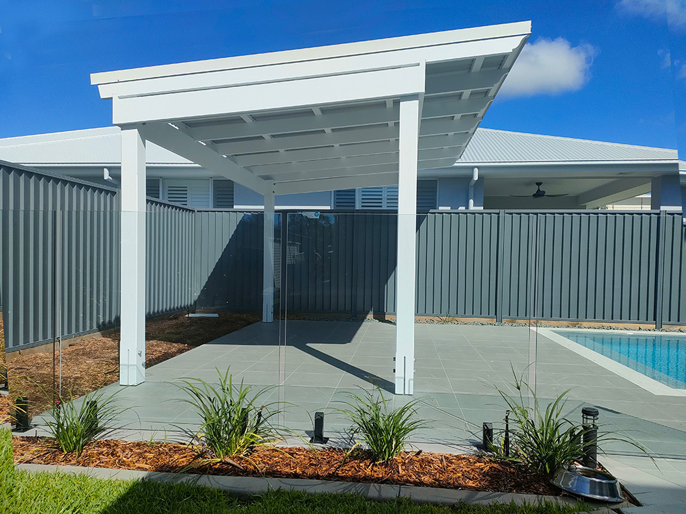 The roofed Pergola is a Skillion style roof and it looks lovely creating a new entertainment area beside the pool.