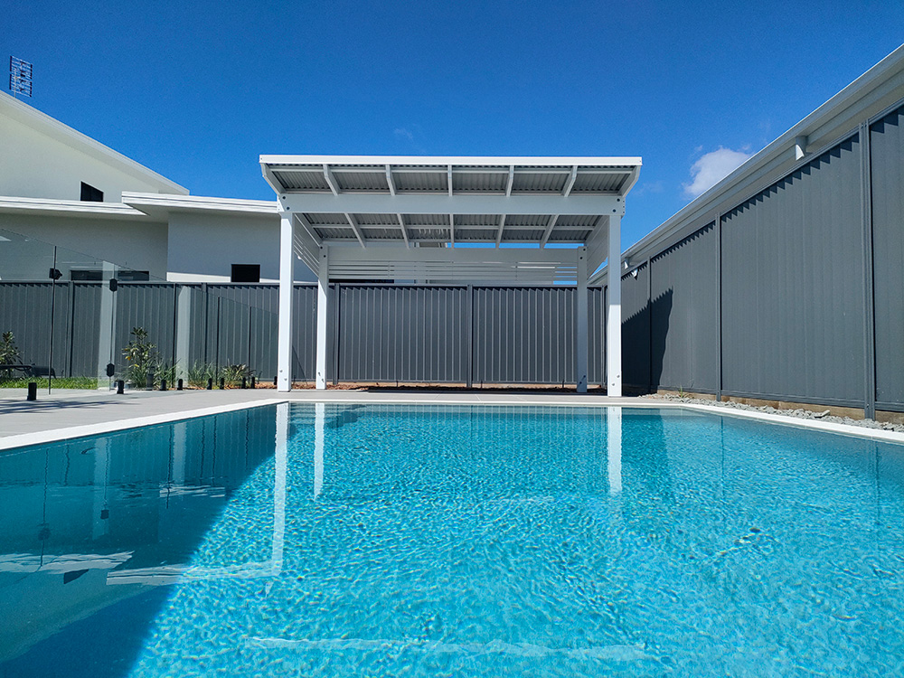 This Roofed Pergola looks beautiful overlooking the pool at this residence in Pelican Waters on the Sunshine Coast.