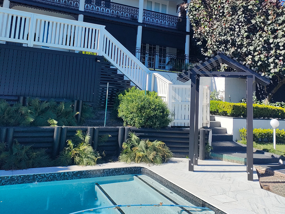 The Black Arbour matches the other black accent elements that have been added to this back yard and pool renovation. The Black Entrance Arbour is a feature from both above as you walk down to the pool and as a focal point from the pool surround sitting area.